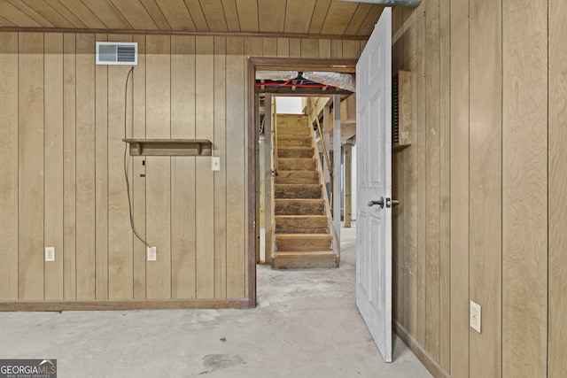 basement with wood walls and wooden ceiling