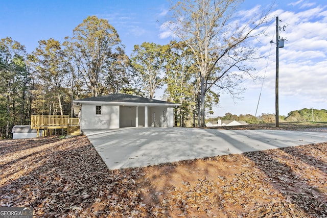 back of property featuring a deck