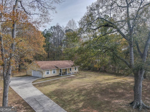 view of front facade featuring a front lawn and a garage