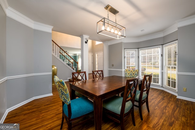 dining area with ornate columns, crown molding, and dark hardwood / wood-style floors