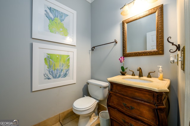 bathroom with tile patterned floors, vanity, and toilet