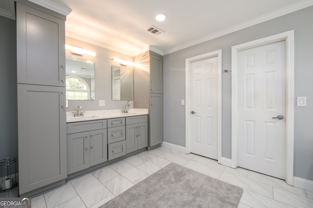 bathroom with crown molding and vanity