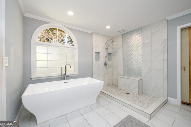 bathroom featuring ornamental molding, sink, and plus walk in shower