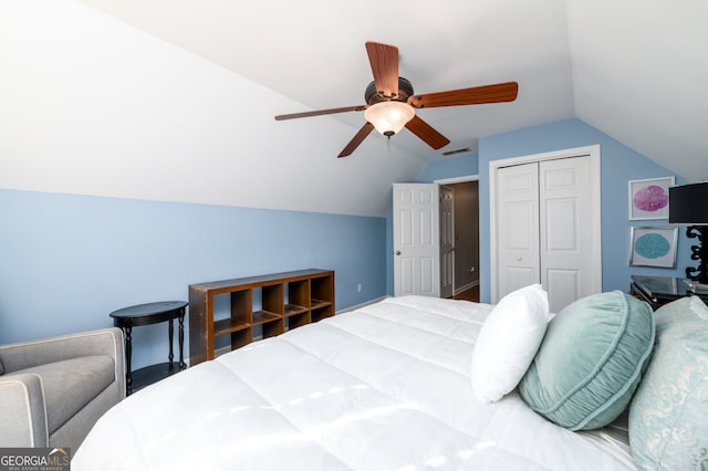 bedroom featuring a closet, lofted ceiling, and ceiling fan