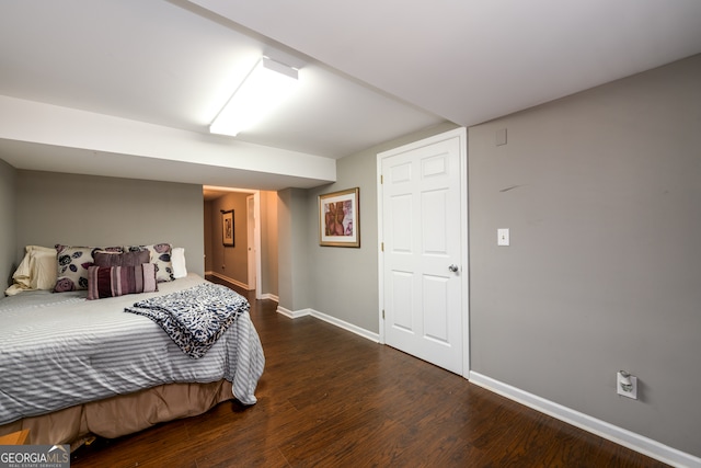 bedroom featuring dark hardwood / wood-style flooring