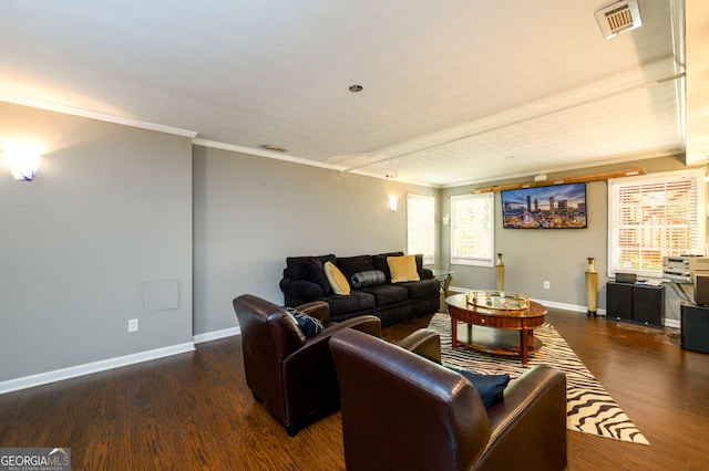 living room featuring dark hardwood / wood-style floors and ornamental molding