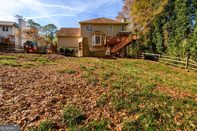 back of property with a wooden deck