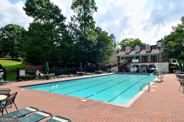 view of pool featuring a patio area