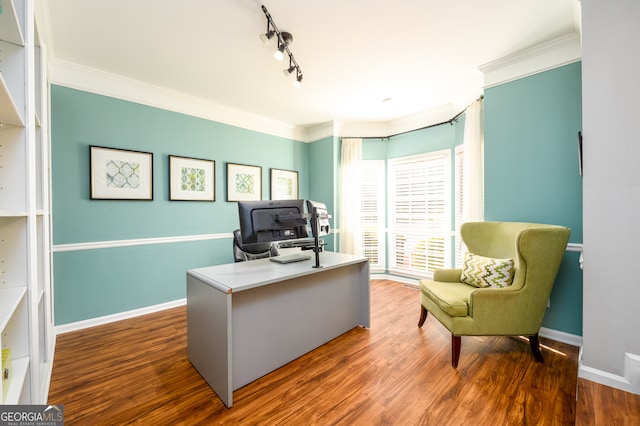 office area with hardwood / wood-style floors, rail lighting, and ornamental molding