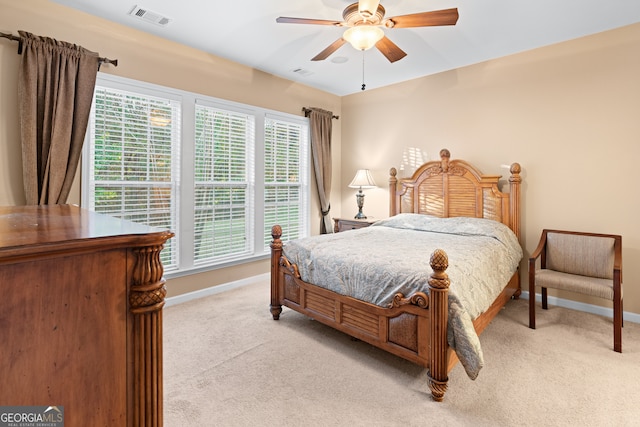 bedroom with light carpet, baseboards, and visible vents