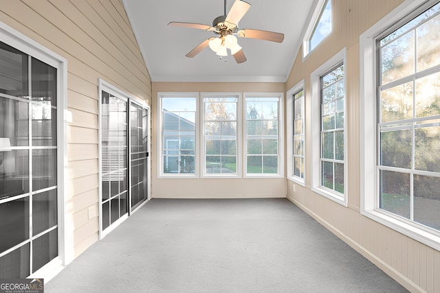 unfurnished sunroom with vaulted ceiling, ceiling fan, and a healthy amount of sunlight