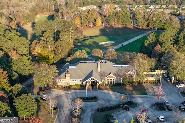 birds eye view of property with a wooded view