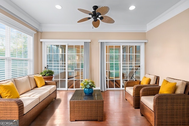 sunroom / solarium with a ceiling fan