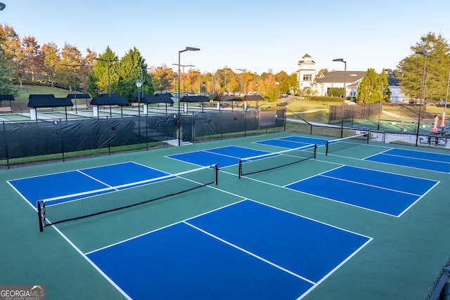 view of sport court featuring fence