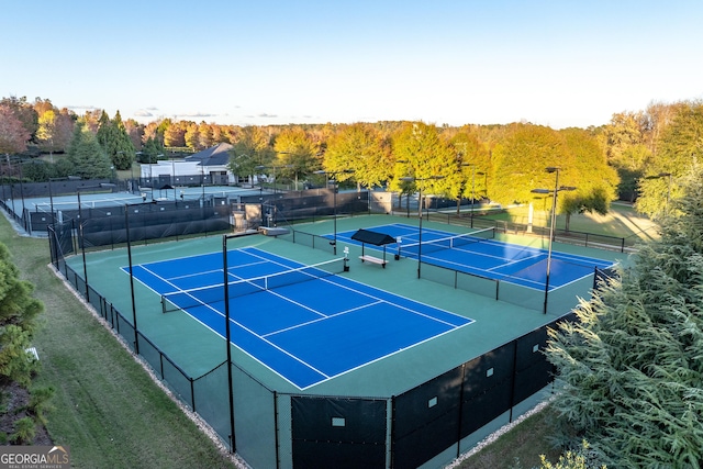 view of sport court featuring fence