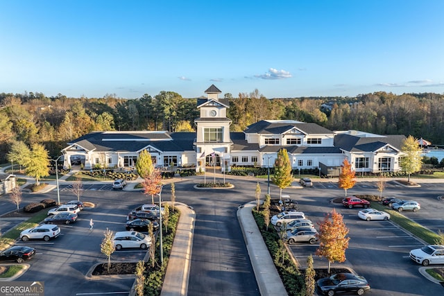 aerial view featuring a residential view and a wooded view