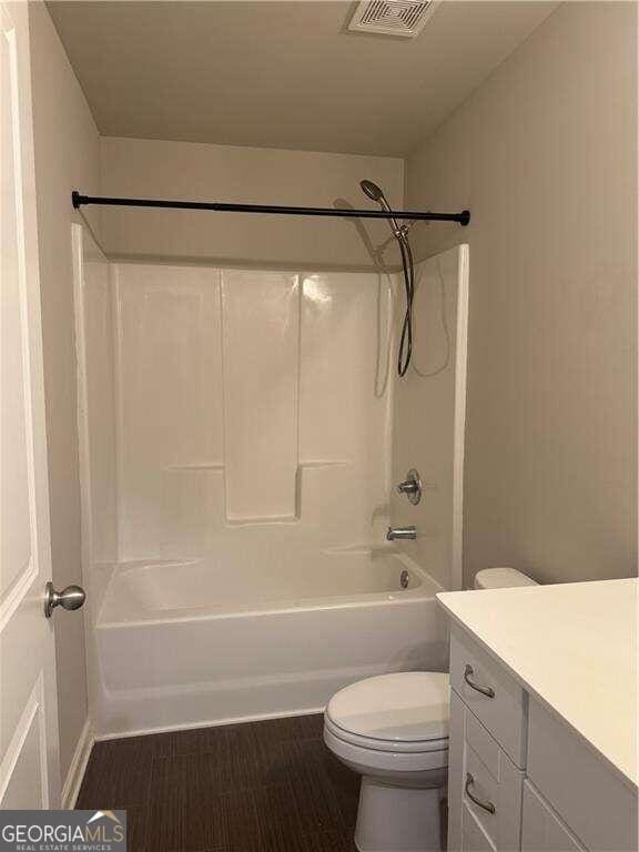 full bathroom with vanity,  shower combination, and toilet