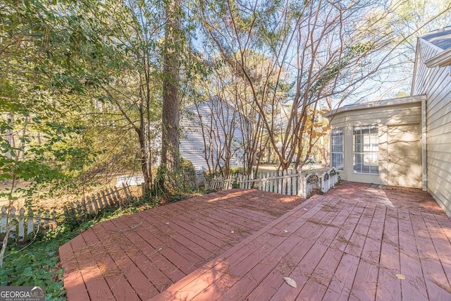 wooden terrace featuring a patio area