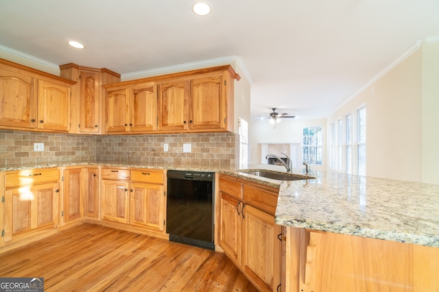 kitchen with sink, dishwasher, ornamental molding, and light hardwood / wood-style flooring