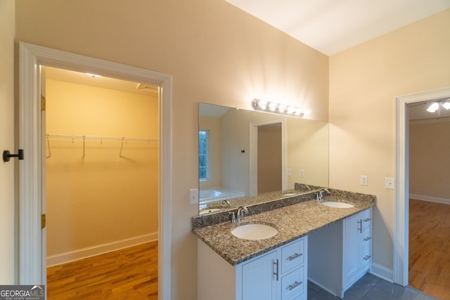 bathroom featuring hardwood / wood-style floors and vanity