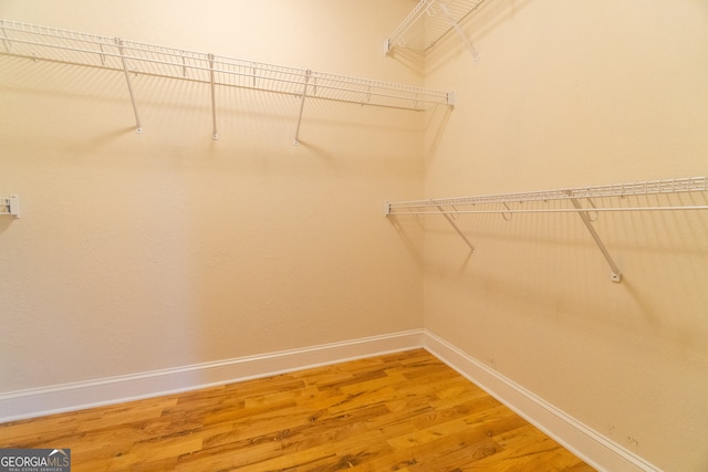 walk in closet featuring hardwood / wood-style floors