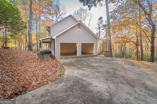 view of side of home with a garage