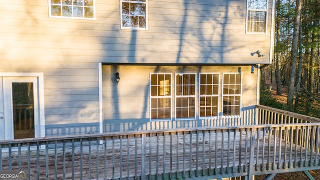 rear view of house with a wooden deck