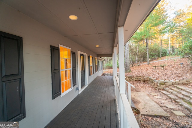 wooden terrace featuring covered porch