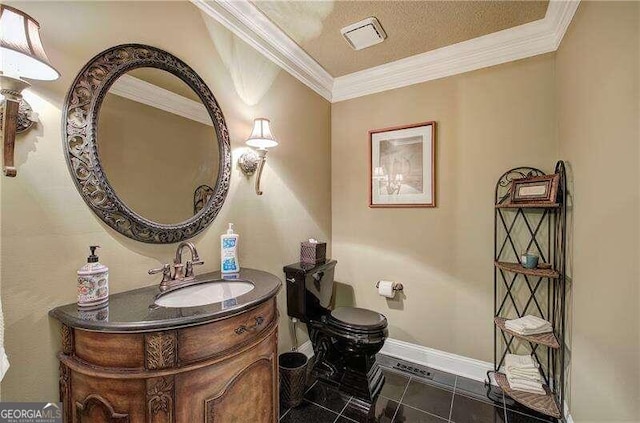 bathroom with tile patterned floors, crown molding, vanity, and a textured ceiling