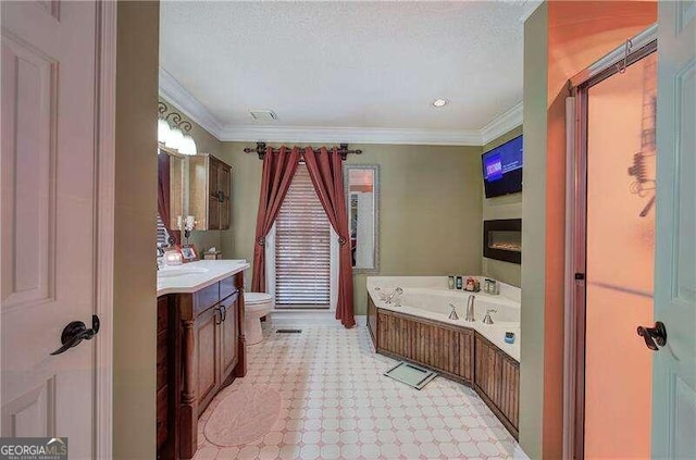 bathroom featuring vanity, a bath, toilet, ornamental molding, and a textured ceiling