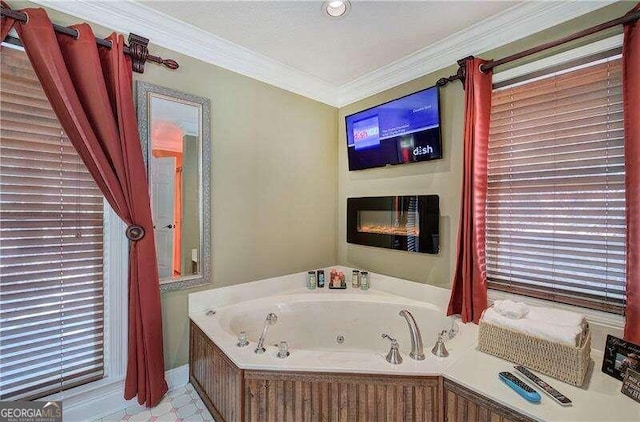 bathroom with a bath and ornamental molding