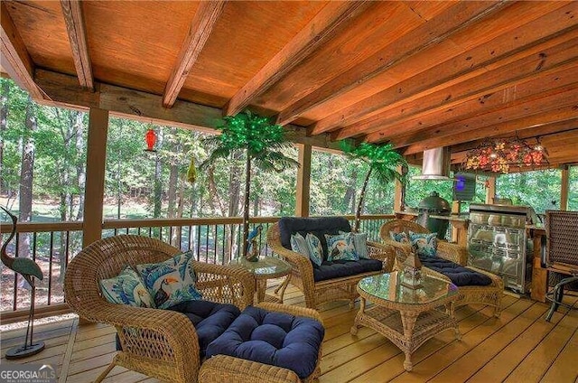 sunroom with beam ceiling and wooden ceiling