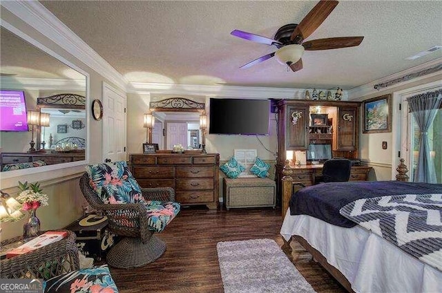 bedroom with a textured ceiling, dark hardwood / wood-style floors, ceiling fan, and crown molding