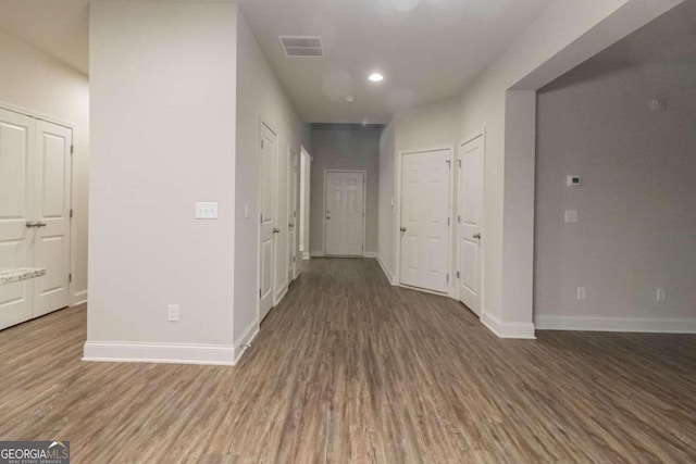 hall with dark hardwood / wood-style floors