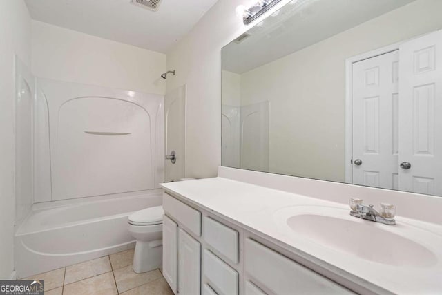 full bathroom with tile patterned flooring, vanity, tub / shower combination, and toilet