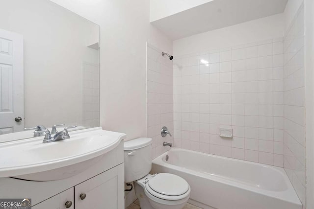 full bathroom featuring vanity, toilet, and tiled shower / bath