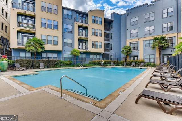 view of swimming pool featuring a patio