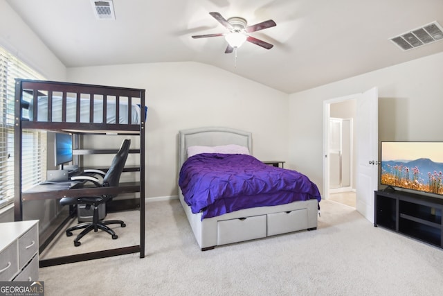 carpeted bedroom with connected bathroom, ceiling fan, and lofted ceiling