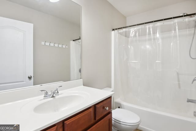 full bathroom featuring shower / tub combo with curtain, vanity, and toilet