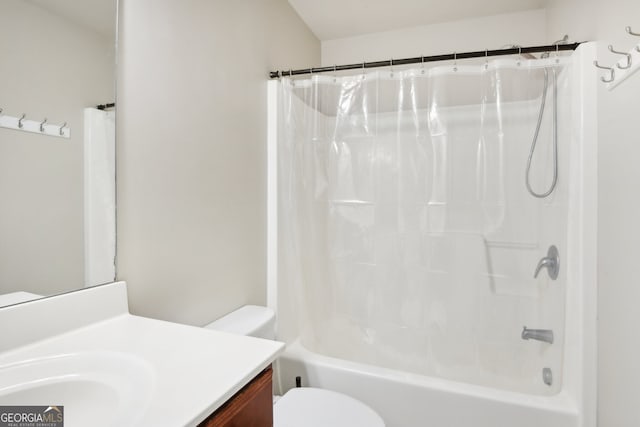 full bathroom with vanity, shower / bath combination with curtain, and toilet