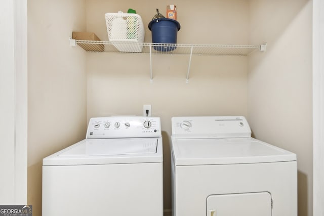 laundry area with independent washer and dryer