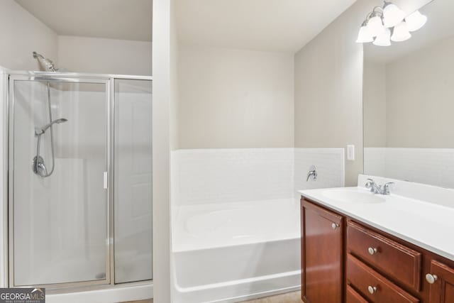 bathroom with plus walk in shower and vanity