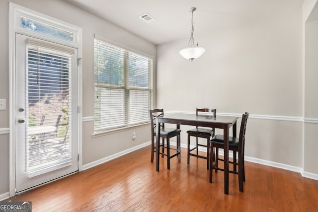 dining area with hardwood / wood-style floors