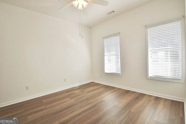 unfurnished room featuring ceiling fan and hardwood / wood-style flooring