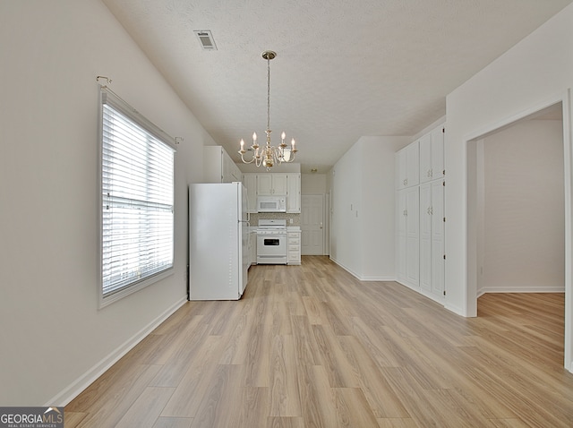 kitchen featuring white cabinetry, white appliances, and light hardwood / wood-style flooring