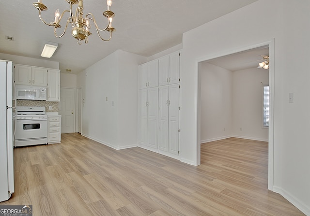 kitchen featuring tasteful backsplash, white cabinetry, light hardwood / wood-style flooring, and white appliances