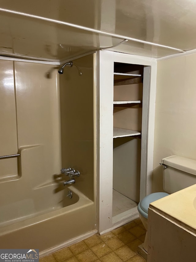 bathroom with shower / bath combination and toilet