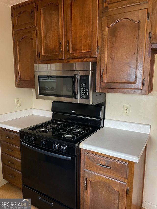 kitchen featuring black gas stove