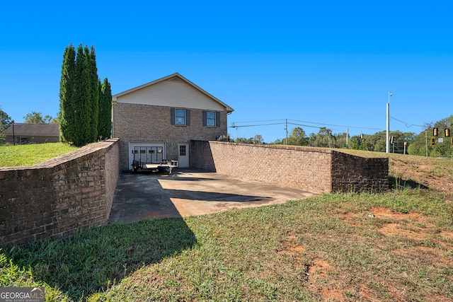 rear view of house with a patio area and a yard