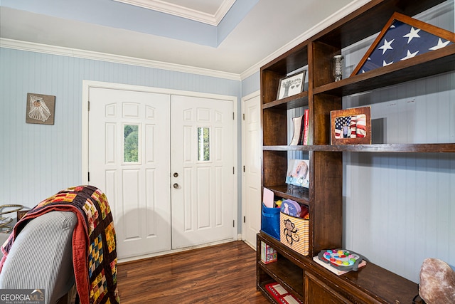 foyer featuring dark hardwood / wood-style floors and crown molding